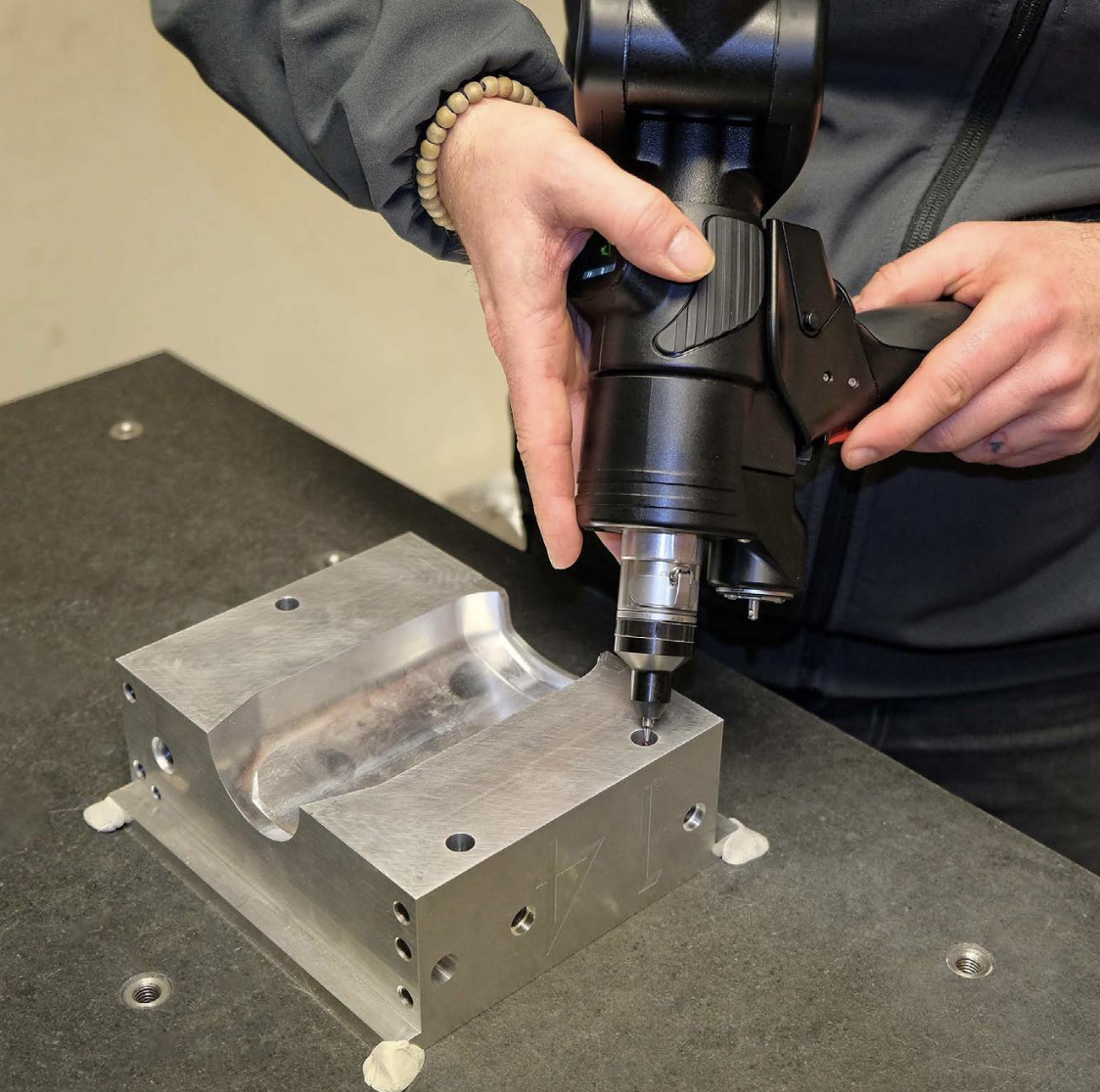 Close-up of the blow mould being inspected